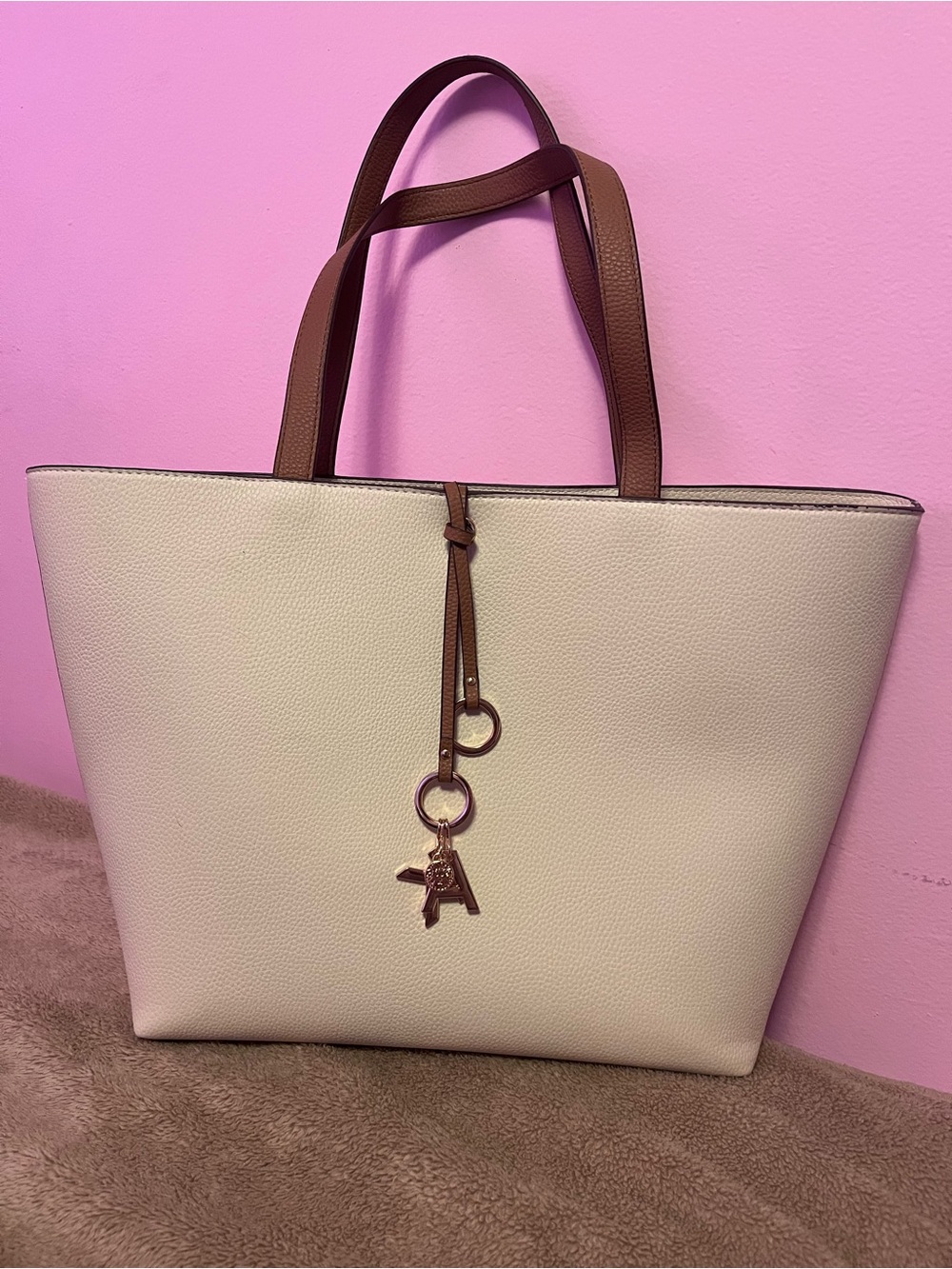 Anne Klein Cream Tote with Brown Handles and Charm Accent